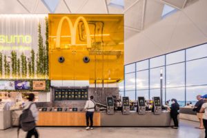 Modern designed McDonald's at Sydney International Airport, with an open kitchen and serving area